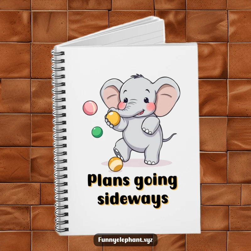 Funny elephant notebook depicting a clumsy elephant tripping while juggling, a humorous item for notes and ideas.