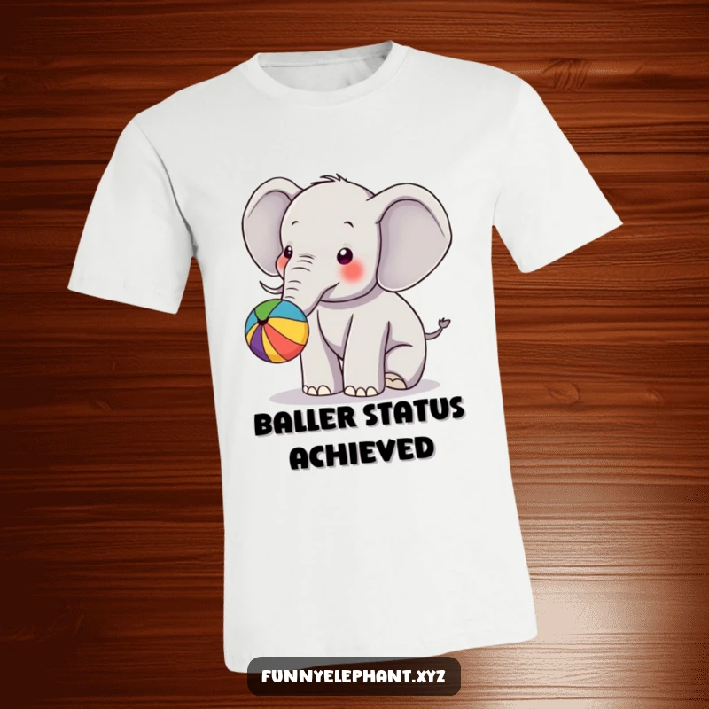 Funny t-shirt depicting an elephant playfully bouncing a colorful ball with its trunk, showcasing a happy, energetic scene.